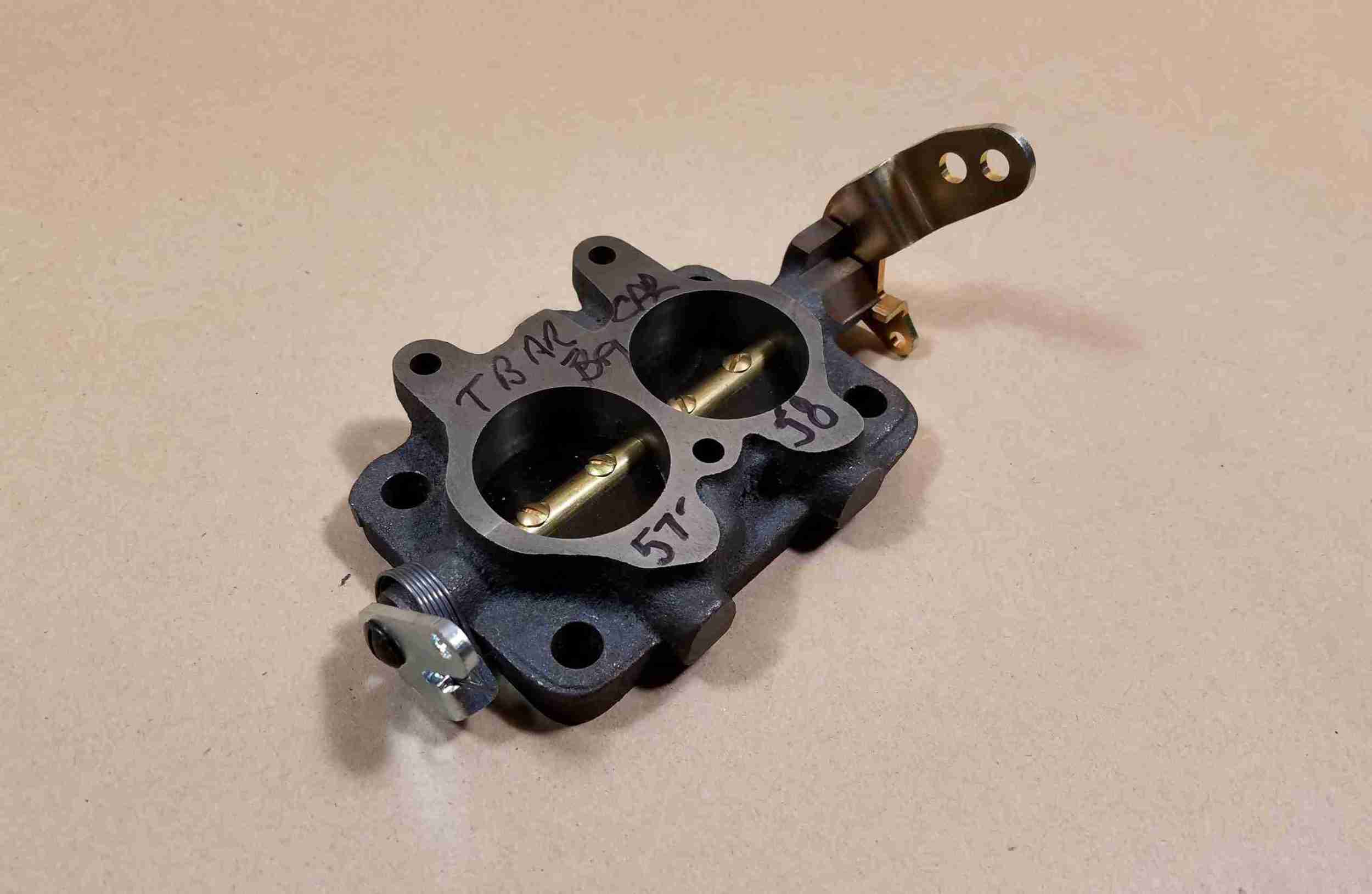 1957-58 Tripower Rear Carburetor Base Throttle Body, progressive linkage type